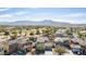 Scenic aerial view of homes backing onto a golf course, with mountains in the background at 4019 W Valley View Dr, Laveen, AZ 85339