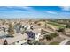 Community aerial view showcasing homes near a golf course with mountain views in the distance at 4019 W Valley View Dr, Laveen, AZ 85339