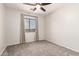 Bedroom with carpeted floor, neutral walls, a ceiling fan and window that offer natural light at 4019 W Valley View Dr, Laveen, AZ 85339