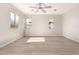 Airy bonus room with lots of natural light highlighting the wood-look tile floor at 4019 W Valley View Dr, Laveen, AZ 85339