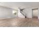 Bright living room with tile floors, stairs, ceiling fan, and natural light at 4019 W Valley View Dr, Laveen, AZ 85339