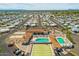 Aerial view of the community featuring mature trees, community pool, and recreation area at 4065 E University Dr # 407, Mesa, AZ 85205