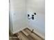 Bright laundry room features new wood-look floors and fresh white paint at 4065 E University Dr # 407, Mesa, AZ 85205