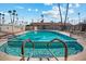 Community pool with lounge chairs and handrails at 4065 E University Dr # 407, Mesa, AZ 85205