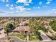 Aerial view of a well-maintained property with a tile roof, manicured lawn, and mature trees at 4222 E Brown Rd # 18, Mesa, AZ 85205