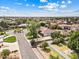 Expansive aerial view of a residential neighborhood showcasing diverse homes, green landscaping, and tree-lined streets at 4222 E Brown Rd # 18, Mesa, AZ 85205