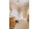 Cozy bathroom with patterned wall paper, decorative vanity and tub-shower combo at 4222 E Brown Rd # 18, Mesa, AZ 85205