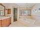 Luxurious bathroom with a soaking tub, walk-in shower and marble finishes at 4222 E Brown Rd # 18, Mesa, AZ 85205