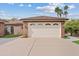 Detached two-car garage offering ample parking and storage solutions, complemented by a well-maintained driveway at 4222 E Brown Rd # 18, Mesa, AZ 85205