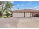 Spacious three-car garage featuring ample parking space and a convenient side entrance at 4222 E Brown Rd # 18, Mesa, AZ 85205