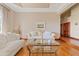 Bright living room featuring plush sofas, hardwood floors, and a decorative ceiling for comfortable relaxation at 4222 E Brown Rd # 18, Mesa, AZ 85205