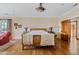 Bright and airy main bedroom featuring hardwood floors, decorative lamps, and custom furnishings at 4222 E Brown Rd # 18, Mesa, AZ 85205