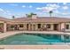 A luxurious outdoor living area with a pool, patio, and ample seating, perfect for relaxing at 4222 E Brown Rd # 18, Mesa, AZ 85205