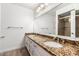 Elegant bathroom with double sinks, granite countertops, and a large mirror at 4323 W Villa Theresa Dr, Glendale, AZ 85308