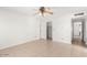 Bedroom featuring tile flooring, a closet, and a ceiling fan at 4323 W Villa Theresa Dr, Glendale, AZ 85308