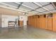 Spacious garage with built-in storage cabinets and ample room at 4323 W Villa Theresa Dr, Glendale, AZ 85308