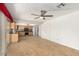 Open-concept kitchen featuring oak cabinets, tile countertops, and stainless steel appliances at 4323 W Villa Theresa Dr, Glendale, AZ 85308