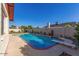 Inviting backyard pool featuring a diving board, brick trim and privacy wall; perfect for outdoor relaxation and enjoyment at 4323 W Villa Theresa Dr, Glendale, AZ 85308