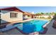 Refreshing pool with diving board offers a perfect backyard oasis at 4323 W Villa Theresa Dr, Glendale, AZ 85308