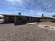 Spacious backyard with gravel, concrete patio, and desert landscaping under blue sky at 4530 E Dragoon Ave, Mesa, AZ 85206