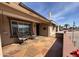 Relaxing covered patio featuring flagstone tile, outdoor seating and a view of the neighborhood at 4530 E Dragoon Ave, Mesa, AZ 85206