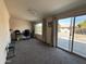 Bright sunroom with sliding glass doors leading to backyard at 4530 E Dragoon Ave, Mesa, AZ 85206