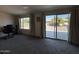 Bright sunroom with sliding glass doors leading to backyard at 4530 E Dragoon Ave, Mesa, AZ 85206