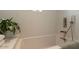 Bright bathroom featuring a soaking tub with stylish fixtures and a serene ambiance at 4530 N 9Th Ave, Phoenix, AZ 85013