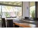 Close-up of the dining table showcasing the stylish table setting and the serene backyard view at 4530 N 9Th Ave, Phoenix, AZ 85013