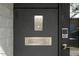 Close up of modern front door featuring a keypad, doorbell and a stainless steel mail slot at 4530 N 9Th Ave, Phoenix, AZ 85013