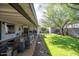 Covered patio overlooking a well-manicured lawn and mature trees, perfect for relaxing at 4530 N 9Th Ave, Phoenix, AZ 85013