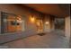 A covered patio features a textured facade and sliding glass doors that lead into the home at 4625 E Thorn Tree Dr, Cave Creek, AZ 85331