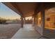 A long covered patio has a textured facade and offers scenic views of the surrounding desert landscape at 4625 E Thorn Tree Dr, Cave Creek, AZ 85331