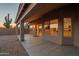 The covered patio has a textured facade, ample lighting, and a view of the desert landscape at 4625 E Thorn Tree Dr, Cave Creek, AZ 85331