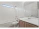 Bright bathroom features a shower-tub combo with a frosted window for privacy at 4625 E Thorn Tree Dr, Cave Creek, AZ 85331