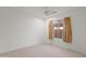 Bright bedroom features a ceiling fan and a window with neutral-toned curtains at 4625 E Thorn Tree Dr, Cave Creek, AZ 85331