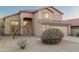 Inviting tan stucco home featuring a tile roof, desert landscaping, and an attached two-car garage at 4625 E Thorn Tree Dr, Cave Creek, AZ 85331