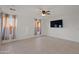 Living room with tile floors, neutral walls, and a ceiling fan for added comfort at 4625 E Thorn Tree Dr, Cave Creek, AZ 85331