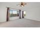 Large main bedroom with a ceiling fan and expansive windows offers views at 4625 E Thorn Tree Dr, Cave Creek, AZ 85331