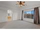 Spacious carpeted main bedroom features an arched doorway and large windows at 4625 E Thorn Tree Dr, Cave Creek, AZ 85331