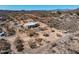 Expansive aerial view of desert property featuring a modern home with a large, private lot at 50408 N 22Nd Ave, New River, AZ 85087