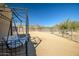 Desert home featuring an outdoor swing set and expansive fenced-in backyard space at 50408 N 22Nd Ave, New River, AZ 85087