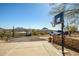 Home featuring a basketball court with views of desert landscape and mountains at 50408 N 22Nd Ave, New River, AZ 85087