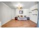 Bright bedroom features a ceiling fan, hardwood floors, and side tables at 50408 N 22Nd Ave, New River, AZ 85087