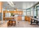 Bright kitchen featuring a center island, wood cabinets, stainless steel appliances, and a skylight at 50408 N 22Nd Ave, New River, AZ 85087