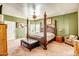 Spacious main bedroom features a four-poster bed, ceiling fan, and natural light at 50408 N 22Nd Ave, New River, AZ 85087