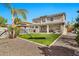 A spacious backyard featuring artificial grass, a hammock, and a quaint gazebo at 5110 S Sandstone St, Gilbert, AZ 85298