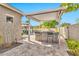 Backyard features a covered bar, a gazebo with seating, and stone tile for relaxing and entertaining guests outdoors at 5110 S Sandstone St, Gilbert, AZ 85298