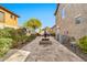 Beautiful backyard featuring a stone patio, a water fountain, and well-maintained landscaping at 5110 S Sandstone St, Gilbert, AZ 85298