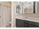 Bathroom with vanity with mirror and shower with curtain at 5110 S Sandstone St, Gilbert, AZ 85298